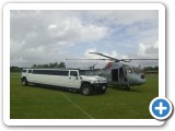 white hummer sat with lynx helicopter two big rides for the special day
